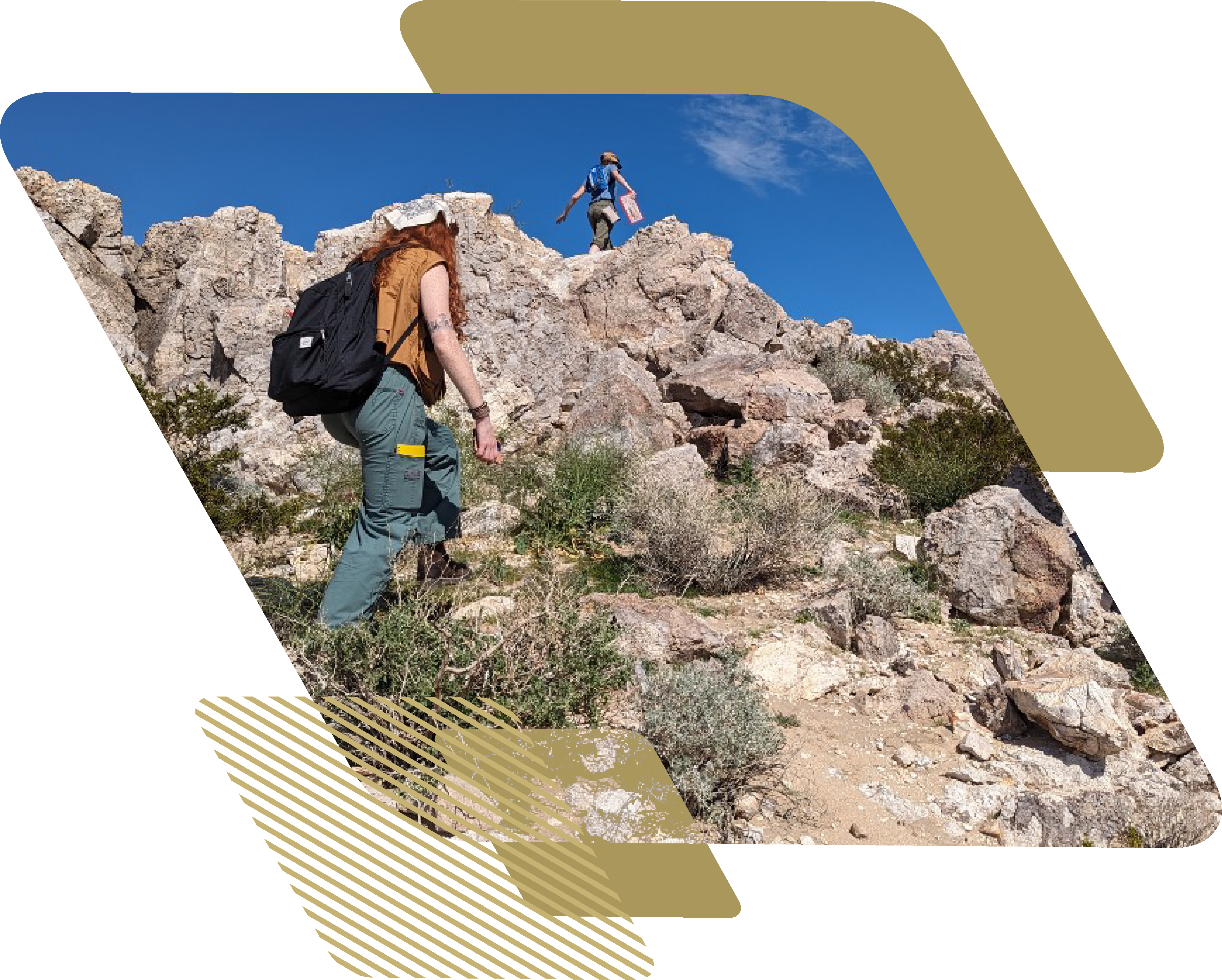 Three students wearing backpacks climb a rocky, arid incline