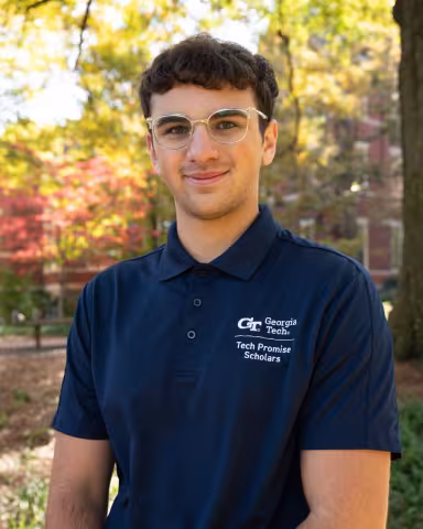 Nick Fabrizio wearing a blue Tech Promise shirt