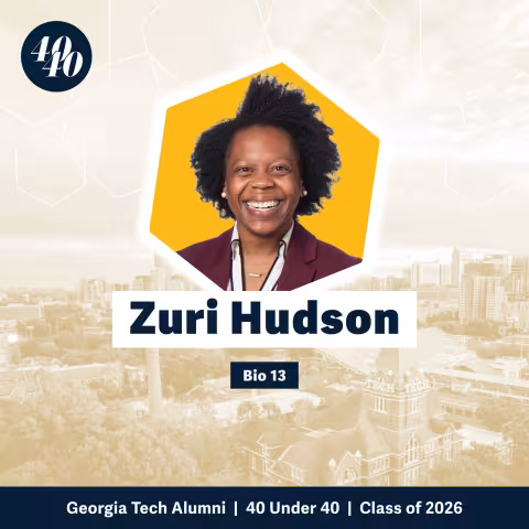 Headshot of Zuri Hudson with a faded background showing Georgia Tech's campus